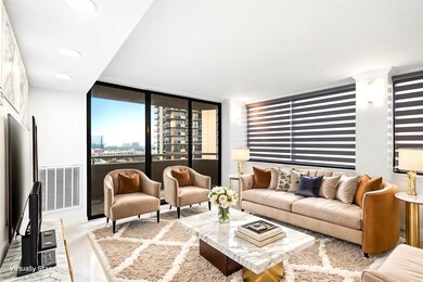 This modern living room features large windows wit