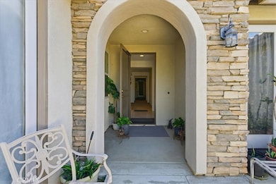 Arched Front entry with beautiful stone.