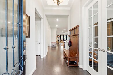 A covered front porch with a video doorbell and stately glass front door with keyless entry will welcome you and your guests. Take a look inside - you will not be disappointed!