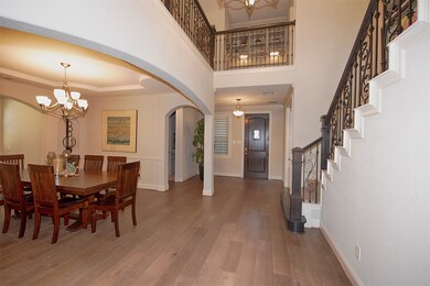 Stunning foyer with hardwood floors as you are greeted by the formal dining room. 