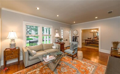 The living room features neutral paint, crisp trim