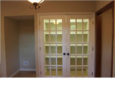 Huge bright pantry with glass paneled French doors