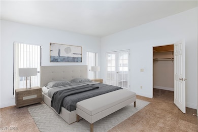 Bedroom featuring a spacious closet, light colored