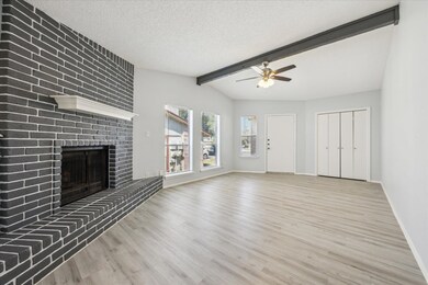 Unfurnished living room with wood finished floors