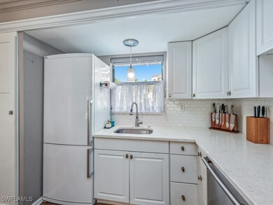 Kitchen with white refrigerator, decorative light