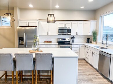 Beautiful kitchen filled w/ natural light, quartz