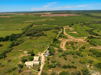 Birds eye view of property featuring a rural view