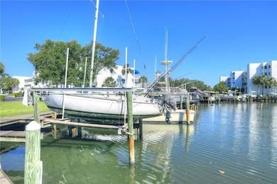 Dock area featuring boat lift and a water view