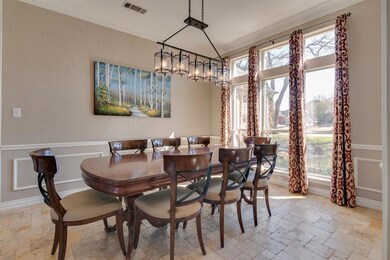 High ceilings, updated lighting and a nice view of the Versailles-patterned Travertine flooring.