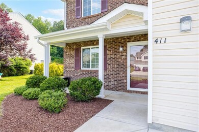 Covered front porch greets you on your way inside