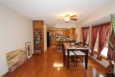 Dining room open to kitchen and living room overlooking the pool.
