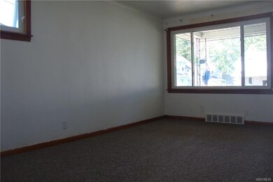 Bright Living Room Opens to Covered Porch for Extr