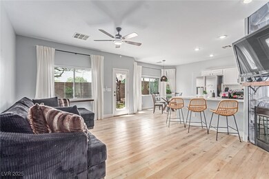 Living room with plenty of natural light, light wo