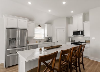Kitchen with appliances with stainless steel finis