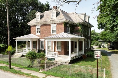 Exterior front showing driveway leading back to ca