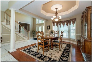 Open dining room with hardwood floors.