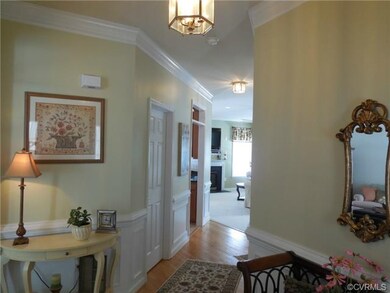 Foyer has wood floors and 2 closets.