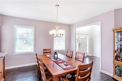 Spacious dining room with double windows to let in lots of light.