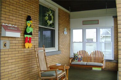 COZY FRONT PORCH FOR RELAXING.