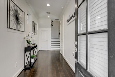 Spacious entryway with hardwood flooring