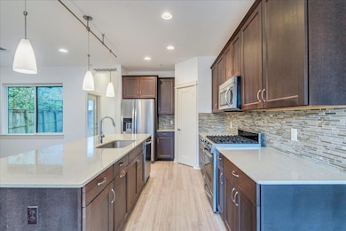 Kitchen featuring appliances with stainless steel