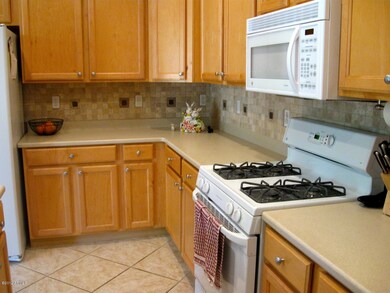 tumbled stone backsplash/corian counters