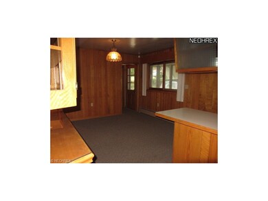 The eating area in the kitchen opens up to a sun-r