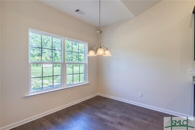 Large window and beautiful chandelier in Dining ro
