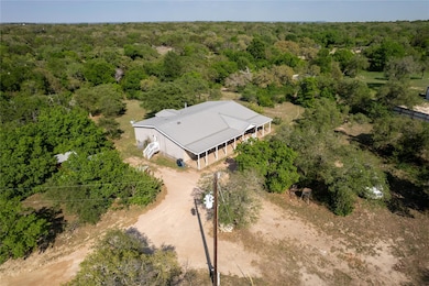 Birds eye view of property with a forest view
