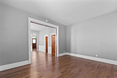 Unit 1 living room opens to dining room