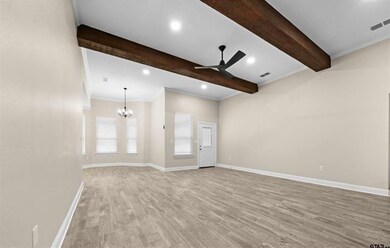 Spare room featuring hardwood / wood-style floorin