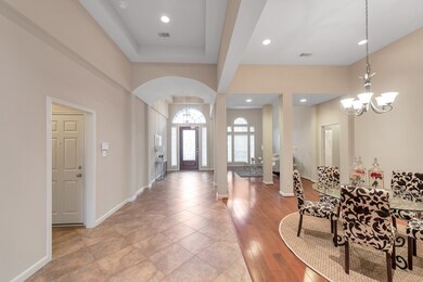 A stunning view of the entrance and formal entertaining areas of this well designed home!  Notice the great architectural details that will follow you throughout the home.