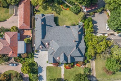 The backyard has lush landscaping and a metal-fram