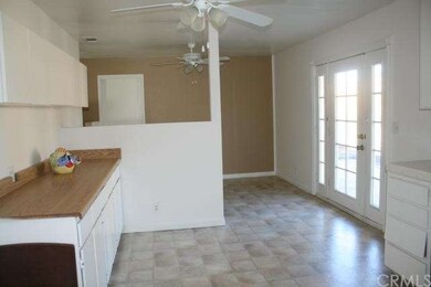 Kitchen into dining area with French doors to back