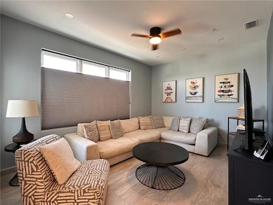 Living area featuring ceiling fan, wood finished floors, and recessed lighting