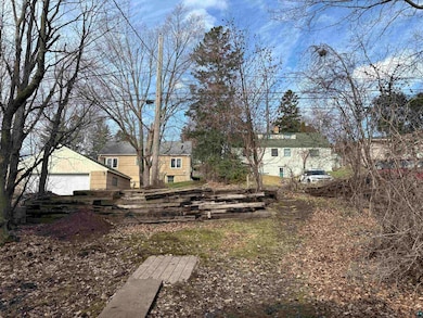 View of yard with a garage