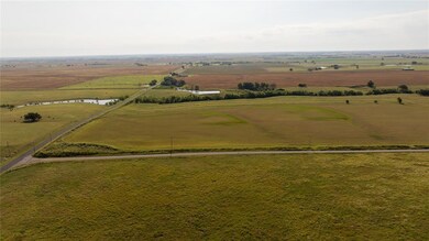 Birds eye view of property with a rural view and a