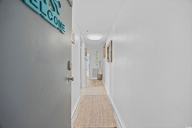 Hallway featuring baseboards