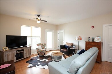 Laminate wood flooring throughout the living, dini