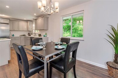 The Dining Area Features the Same Refinished Hardw