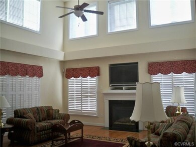 Two-story greatroom with fireplace and plantation 