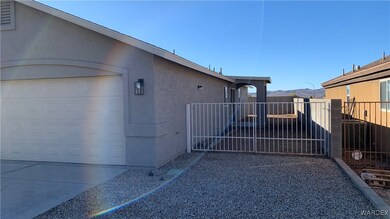 View of side of home featuring a mountain view and