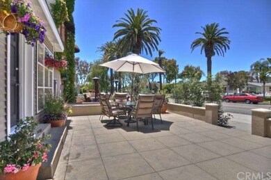 Spacious front patio with beautiful flowers. 