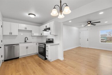 Kitchen with stainless steel appliances, light cou