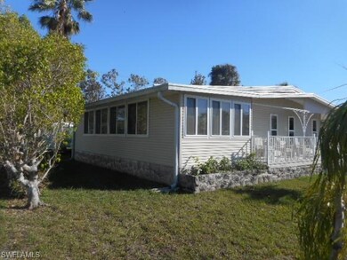 View of property exterior featuring a yard