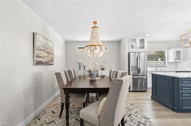 Dining area with light wood-style flooring, basebo