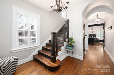 Foyer with Grand Staircase and Coat Closet