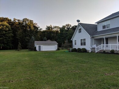 Backyard view with detached garage