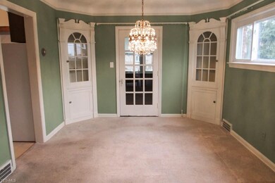 The dining room features corner cabinets and a bea