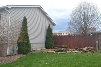 Side of house with fish pond.